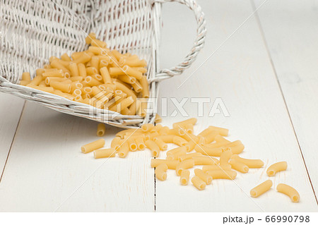 pasta on white old table pasta on white old table 66990798