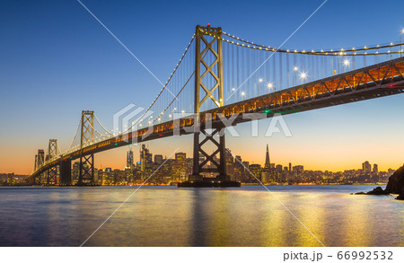 San Francisco skyline with Oakland Bay Bridge at twilight, California, USA 66992532