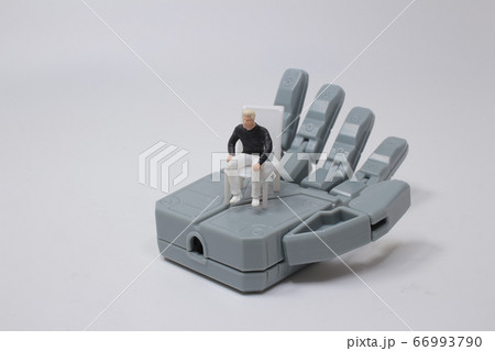 small figure looks up while standing on a huge small figure looks up while standing on a huge 66993790