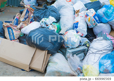 pile of waste in a container. garbage collapse. Janitors ' strike. environmental disaster of plastic recycling 66996569