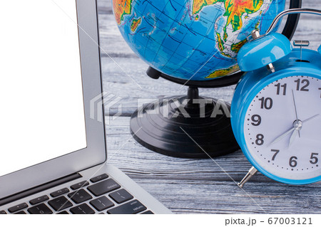 Laptop with globalization and time concept. Laptop with globalization and time concept. 67003121