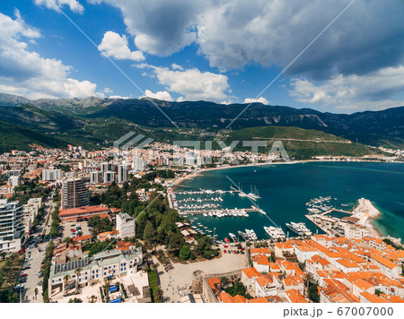 Boat dock and yacht port in Budva, Montenegro. Aerial photo from the drone. Boat dock and yacht port in Budva, Montenegro. Aerial photo from the drone. 67007000