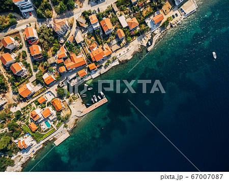 Aerial drone photo, top view - villas, houses and hotels on the beach in Montenegro, the Adriatic Sea. 67007087