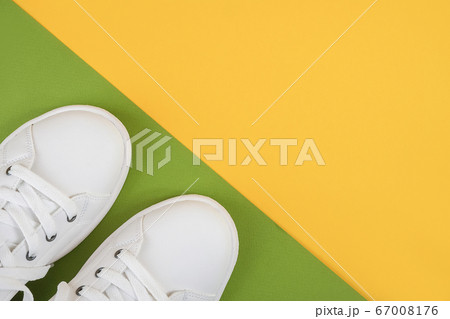 White sports shoes, sneakers with shoelaces on a White sports shoes, sneakers with shoelaces on a 67008176