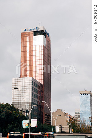 Barcelona, Spain - 15 December 2019: View of Edificio Allianz, Torre Allianz - skyscraper on Carrer de Tarragona Street 103, near Spain square. Completed in 1993, has 20 floors, rises 77 meters. Barcelona, Spain - 15 December 2019: View of Edificio Allianz, Torre Allianz - skyscraper on Carrer de Tarragona Street 103, near Spain square. Completed in 1993, has 20 floors, rises 77 meters. 67009142
