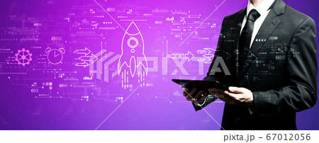 Rapid growth concept with businessman using his tablet 67012056