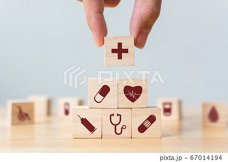Hand arranging wood block stacking with icon healthcare medical, Insurance for your health concept 67014194