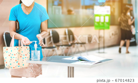 Clear alcohol gel bottles for hand cleaning to prevent the spreading of the corona virus (Covid-19). Place the entrance service with register book for customers before buying in the supermarket. Clear alcohol gel bottles for hand cleaning to prevent the spreading of the corona virus (Covid-19). Place the entrance service with register book for customers before buying in the supermarket. 67014823