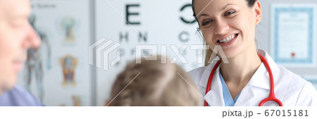 Doctor an optometrist conducts checks vision child 67015181
