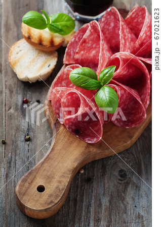 Delicious salami with basil and wine Delicious salami with basil and wine 67021623