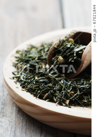Green raw tea on the wooden table Green raw tea on the wooden table 67021844