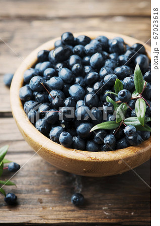 Myrtle berry on the wooden table 67023618