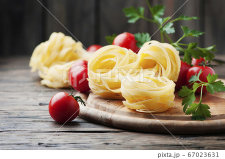 Ingredients for cooking pasta and tomato on the Ingredients for cooking pasta and tomato on the 67023631