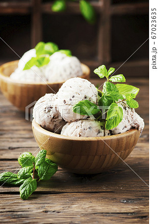 Sweet ice cream with mint and chocolate Sweet ice cream with mint and chocolate 67023635