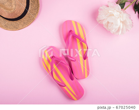 Pink and yellow female flip flops. Flat lay 67025040