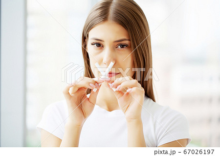 Stop smoking, a young woman communicates her position about the harmfulness of cigarettes Stop smoking, a young woman communicates her position about the harmfulness of cigarettes 67026197