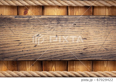 ship rope border at wooden background 67029422