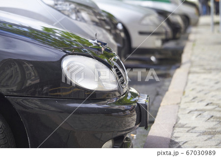 Lots of parked cars in public city parking, Lots of parked cars in public city parking, 67030989