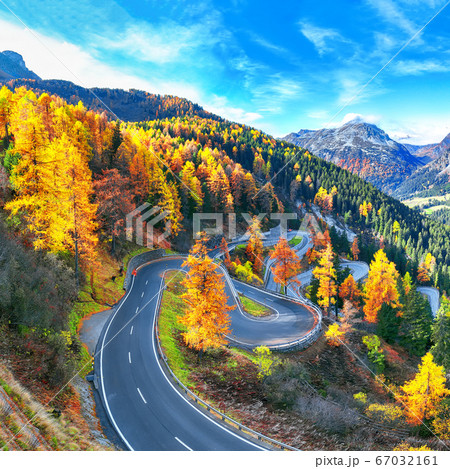 Stunning view of Maloja pass road at autumn time. 67032161