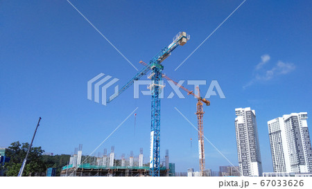 Tower Crane used to lift the heavy load at the construction site. Manually operate by the operator. Normally used at huge scale or high rise building construction.    67033626