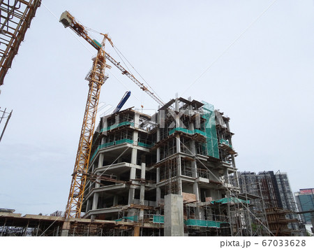 Tower Crane used to lift the heavy load at the construction site. Manually operate by the operator. Normally used at huge scale or high rise building construction.    67033628