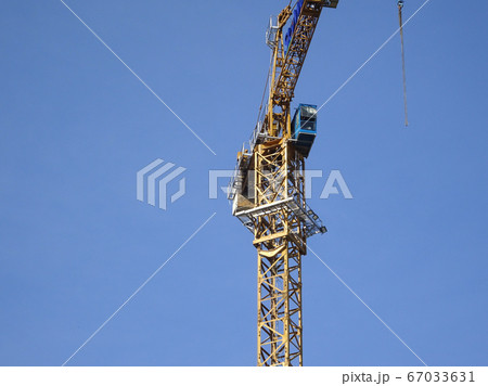 Tower Crane used to lift the heavy load at the construction site. Manually operate by the operator. Normally used at huge scale or high rise building construction.    67033631
