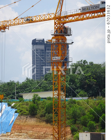 Tower Crane used to lift the heavy load at the construction site. Manually operate by the operator. Normally used at huge scale or high rise building construction.    67033632