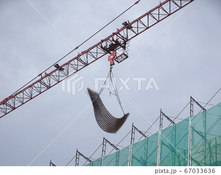 Tower Crane used to lift the heavy load at the construction site. Manually operate by the operator. Normally used at huge scale or high rise building construction.    67033636