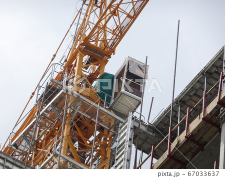 Tower Crane used to lift the heavy load at the construction site. Manually operate by the operator. Normally used at huge scale or high rise building construction.    67033637