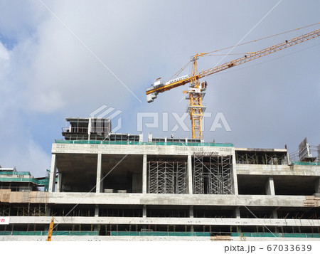 Tower Crane used to lift the heavy load at the construction site. Manually operate by the operator. Normally used at huge scale or high rise building construction.    67033639