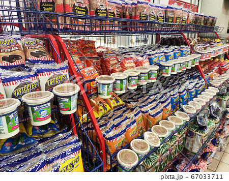 SEREMBAN, MALAYSIA -JUNE 08, 2020: Different types of bread in commercial packages are displayed on shelves for sale. Separated by type and brand to make it easier for customers to choose. SEREMBAN, MALAYSIA -JUNE 08, 2020: Different types of bread in commercial packages are displayed on shelves for sale. Separated by type and brand to make it easier for customers to choose. 67033711