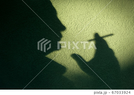 Smoking isues, silhouette of man smoking cigarette Smoking isues, silhouette of man smoking cigarette 67033924