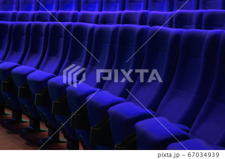 Absolutely empty blue chairs in cinema with nobody Absolutely empty blue chairs in cinema with nobody 67034939