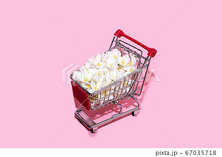 Shopping trolley on pastel pink background with copy space. Shopping trolley on pastel pink background with copy space. 67035718