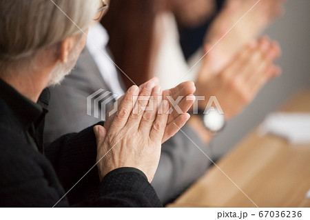 Senior gray-haired businessman clapping hands attending conferen 67036236