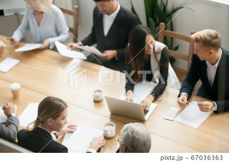 Diverse multiracial business people preparing for group meeting 67036363