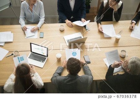 Conference table with business people group working together, te Conference table with business people group working together, te 67036378