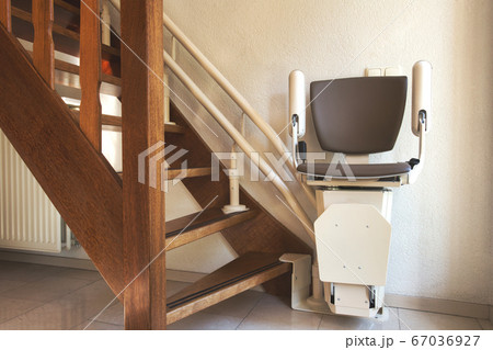 Automatic stairlift on staircase for elderly or disability in a house, 67036927