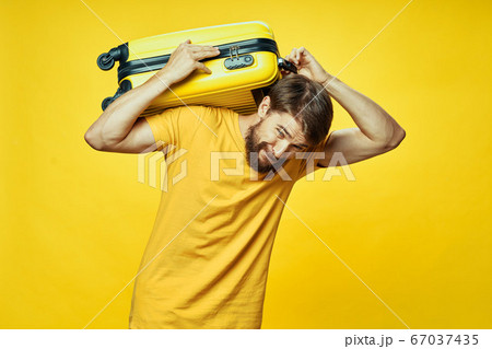 Man with a suitcase on his back 67037435