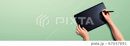 Person using a graphic pen tablet 67037691