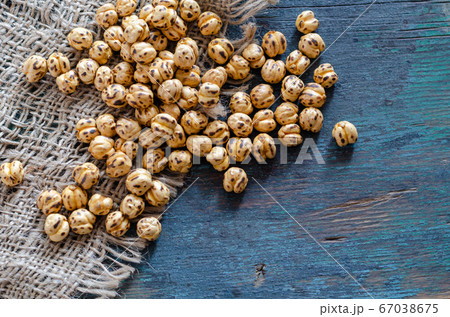 Roasted chickpeas on the wooden table 67038675