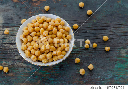 A Bowl of cooked chickpeas on the wooden table -, A Bowl of cooked chickpeas on the wooden table -, 67038701