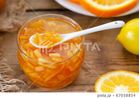 Tasty homemade orange jam and slice of orange Tasty homemade orange jam and slice of orange 67038854