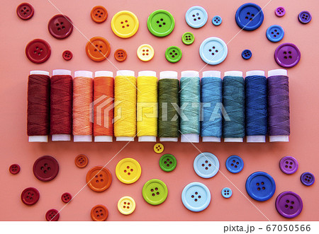 Spools of thread and buttons on the colors of the 67050566