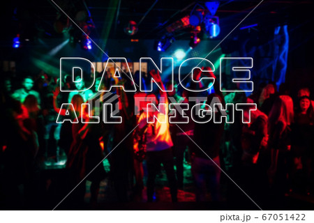 Inscription Dance all night on the background a blurred crowd of dancing people 67051422