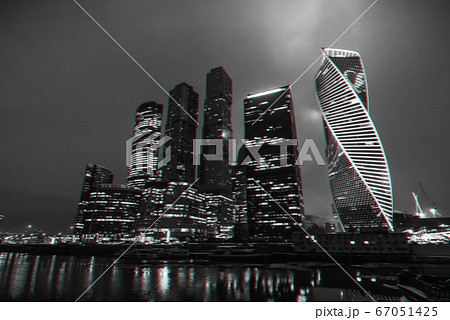 High modern skyscrapers of Moscow city with lighting and reflection in the river 67051425
