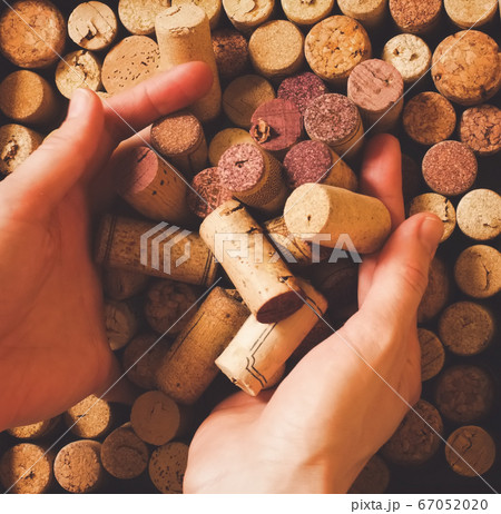 Red white sparkling wine champagne cork and worker hands top view square background in faded hipster style of processing. Red white sparkling wine champagne cork and worker hands top view square background in faded hipster style of processing. 67052020