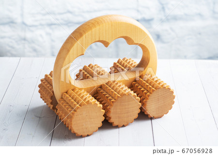 Wooden massage brush roller for manual home massage. Copy space 67056928