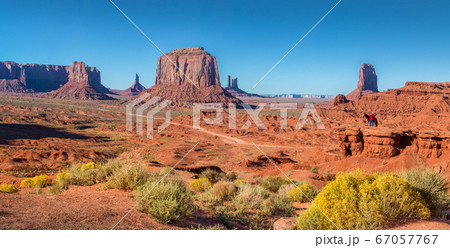 Monument Valley panorama with horse rider at sunset, Arizona, USA 67057767