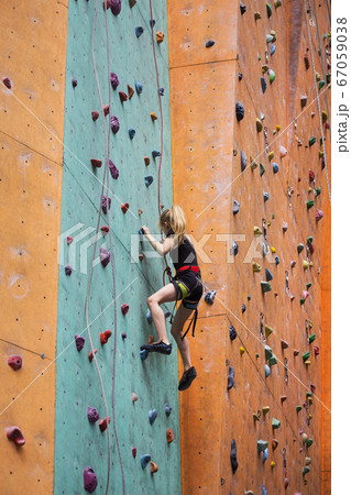 little girl climbing up the wall little girl climbing up the wall 67059038